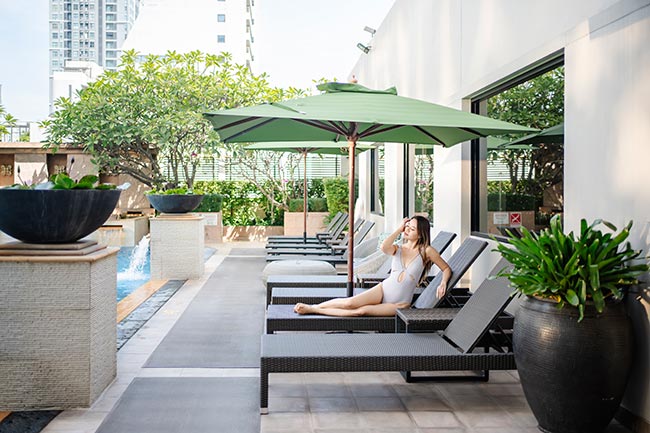 Relaxing by the pool at The Sukosol Hotel, Bangkok
